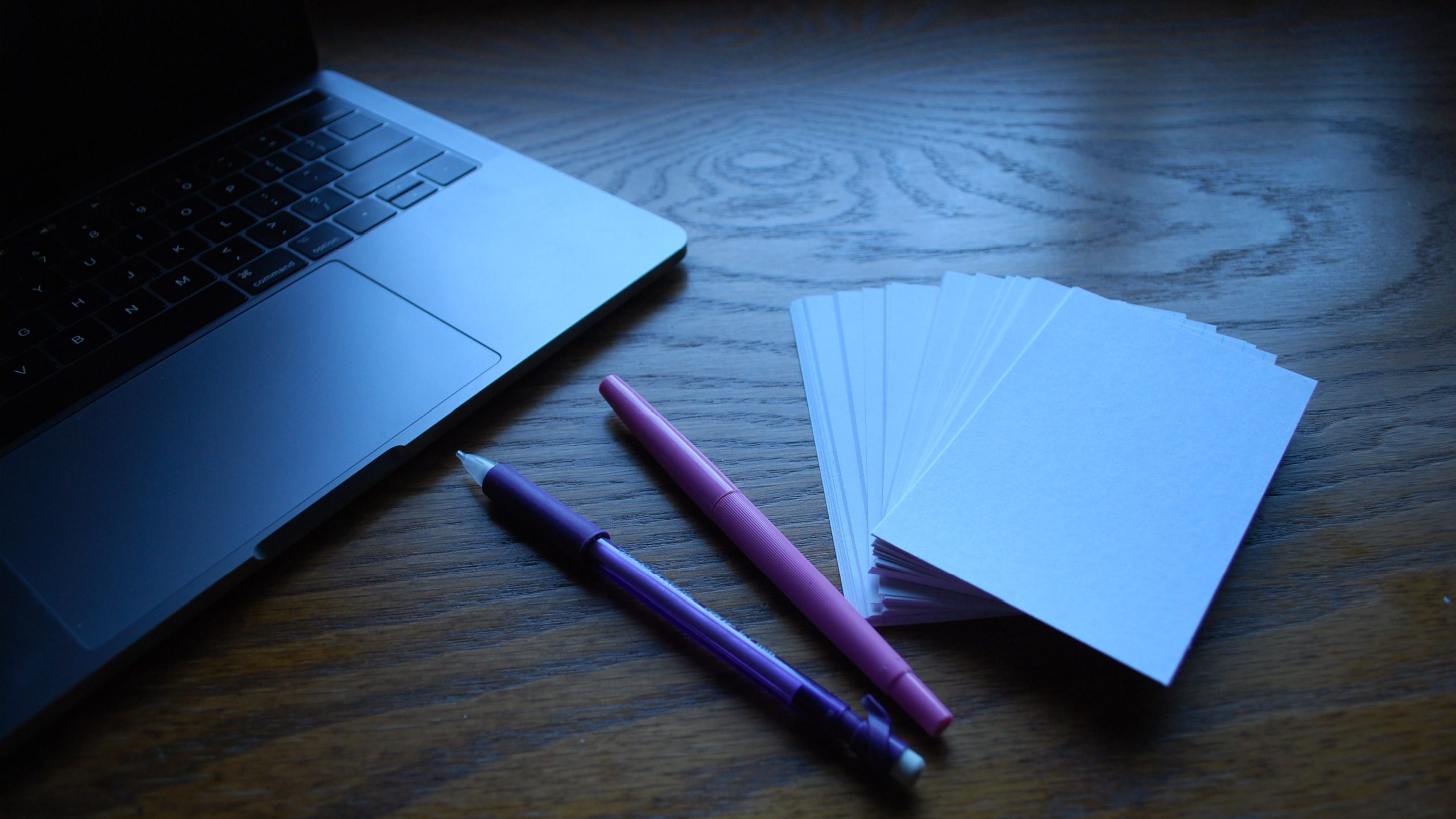 Flashcards sitting on a desk near a laptop, ready to be used for Step 1 biochem prep.